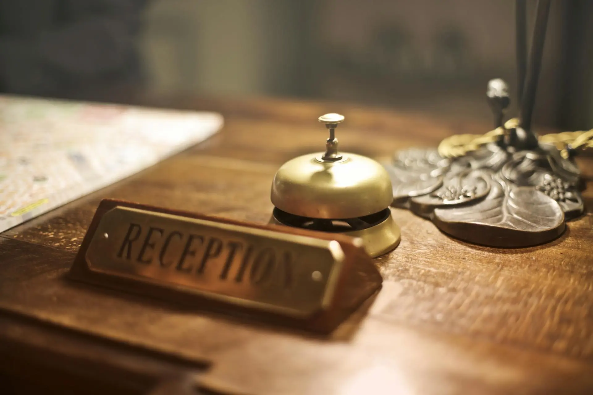 Reception sign and bell on top of a reception desk