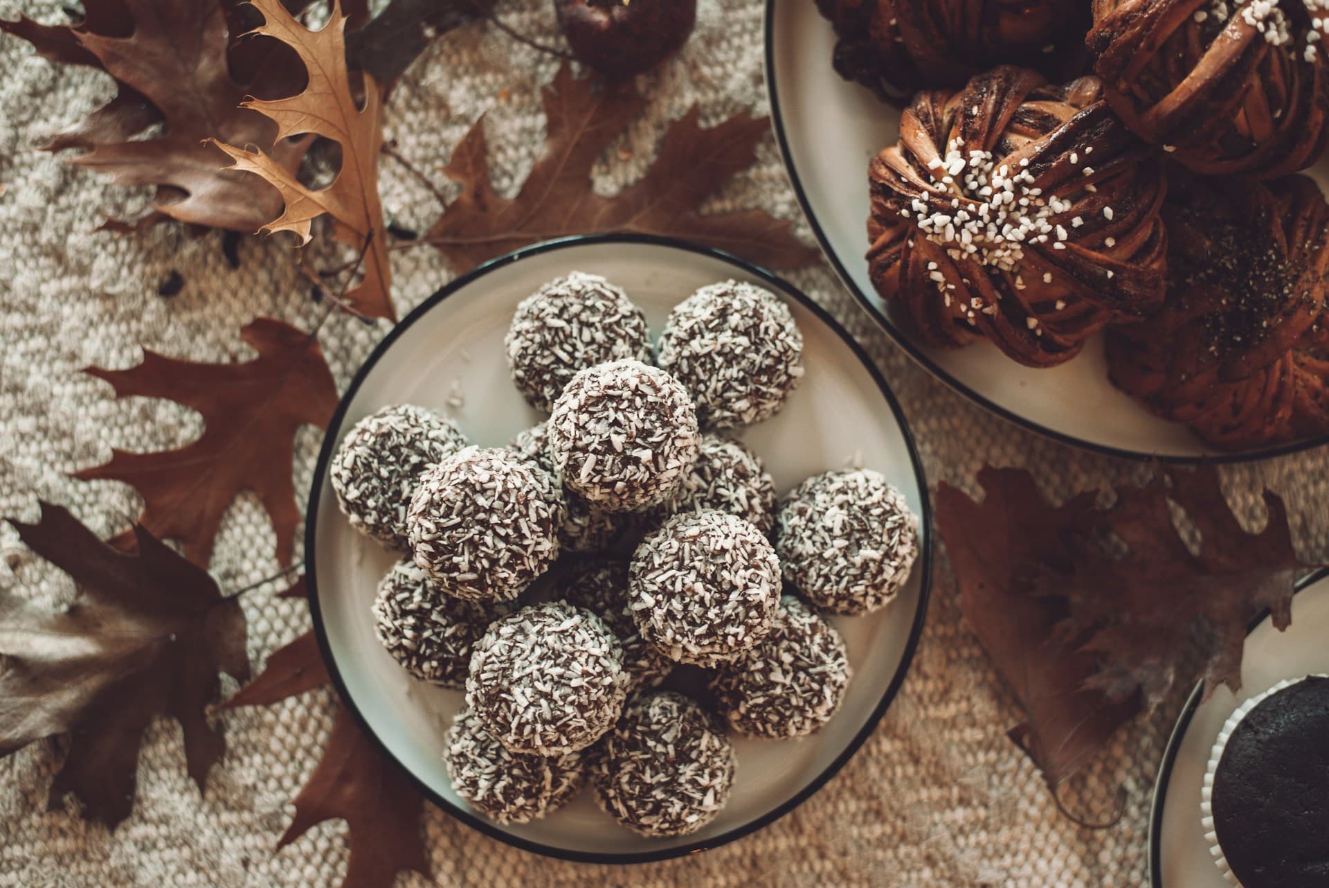 Swedish chocolate balls, cinnamon roll and cardamom rolls in an autumn setting.