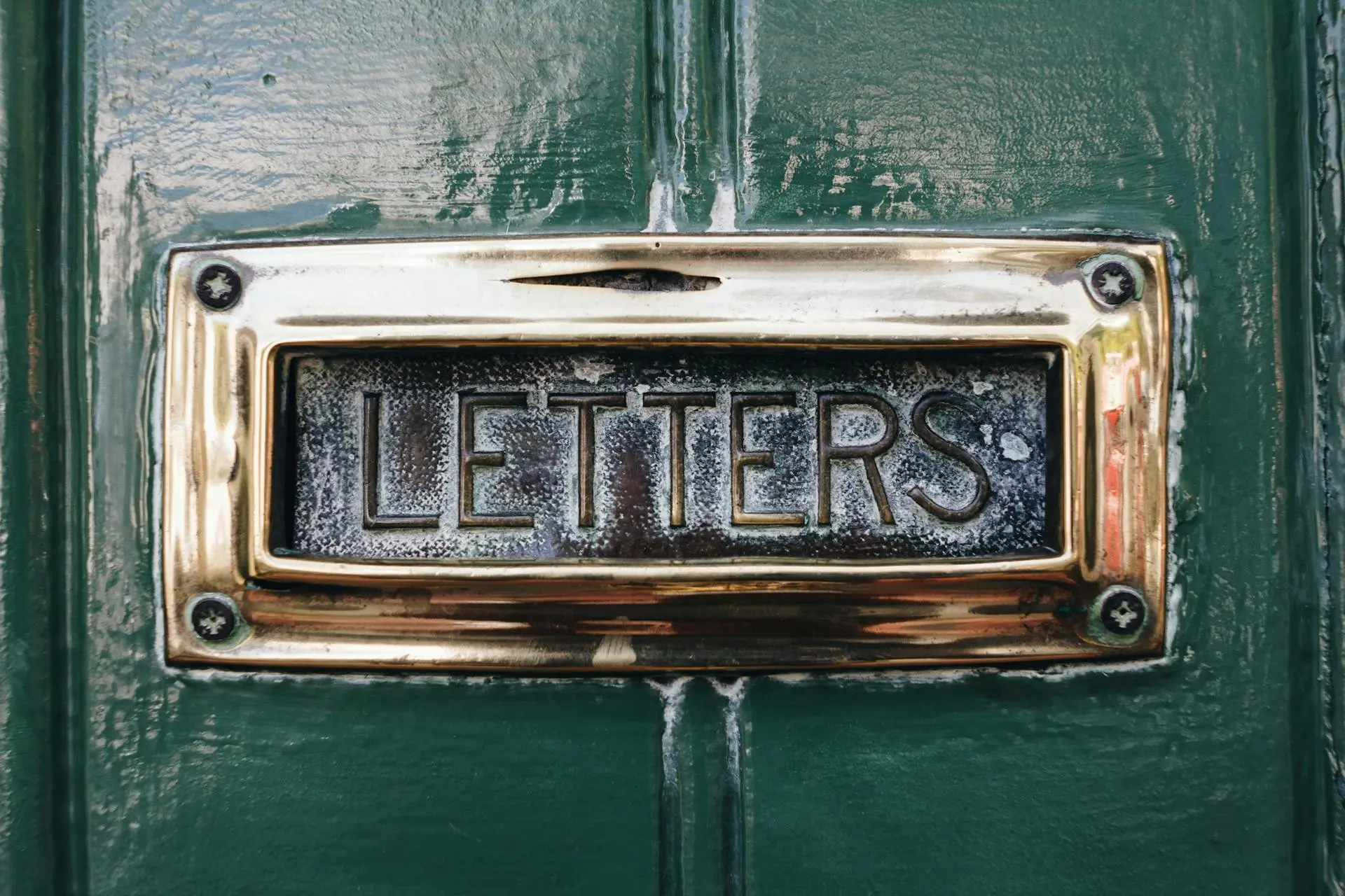 Letters plaque on mailbox