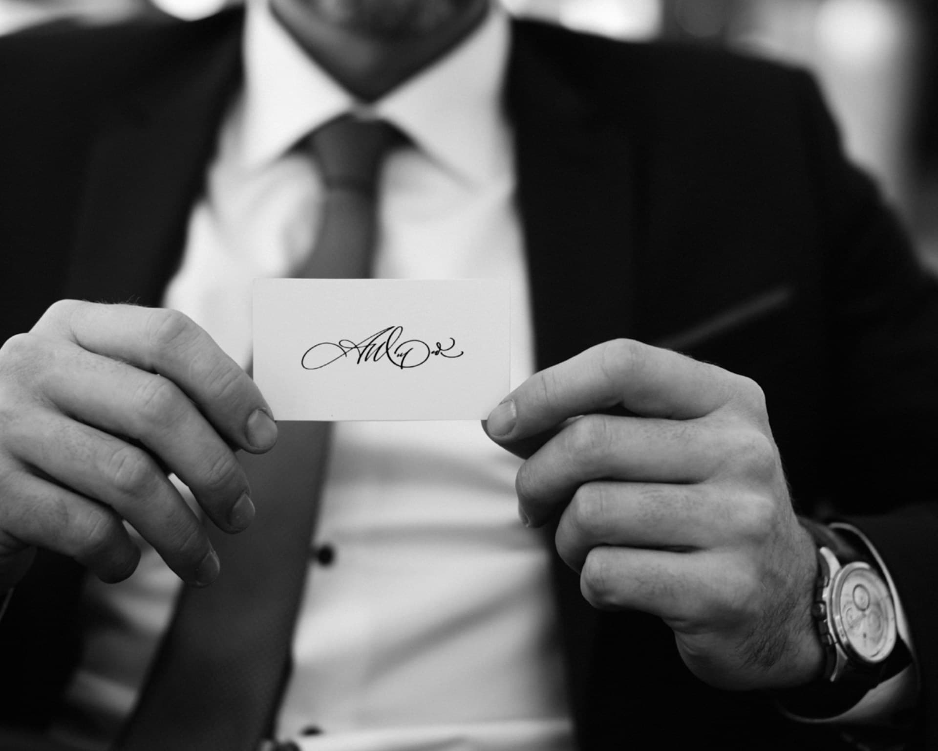 Man holding a signature on a card