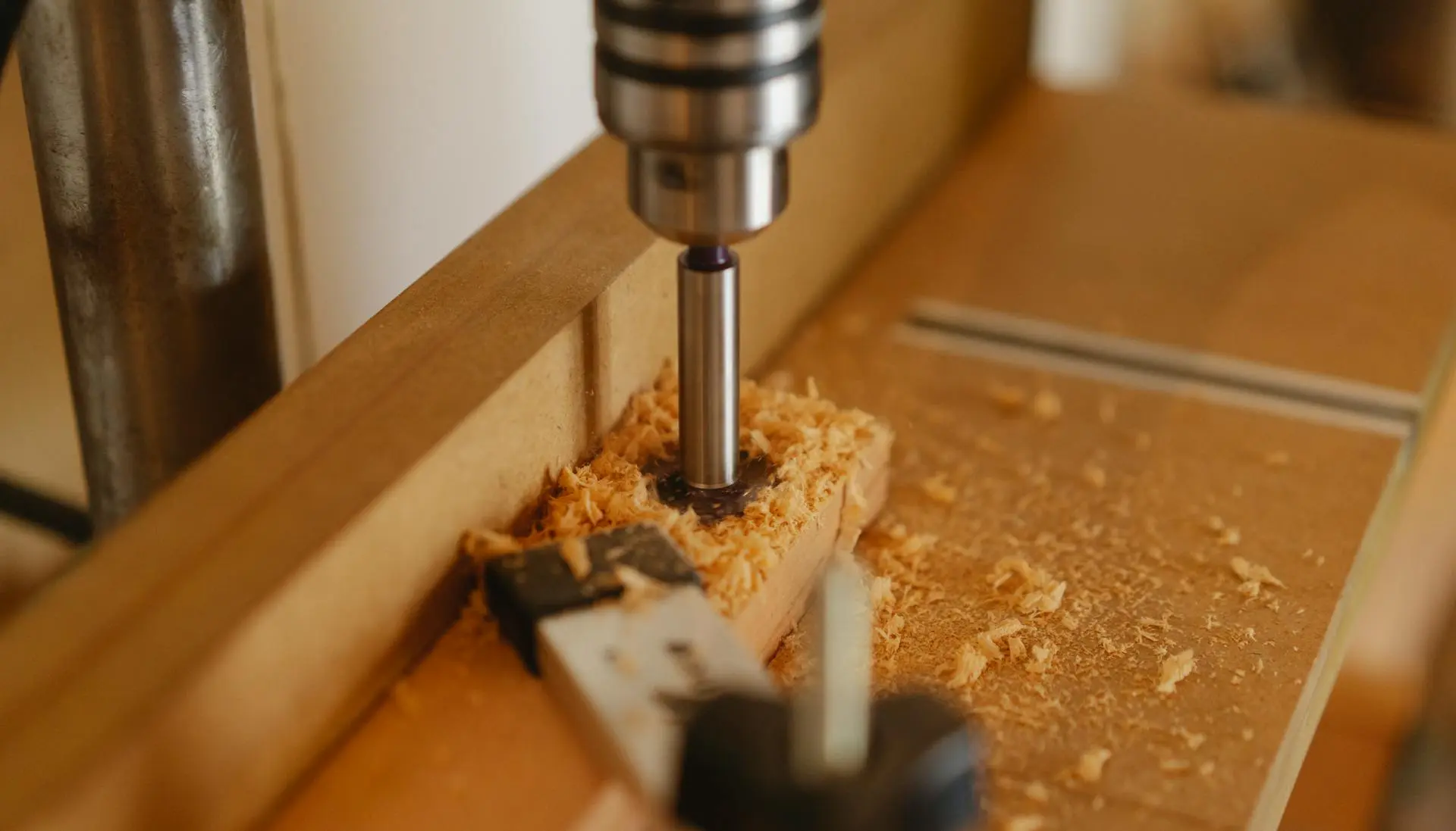 Task automation: Boring machine drilling hole in wooden plank